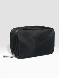 Now in sleek black nylon. The bag Bobbi uses most often for her everyday beauty essentials. Sized to hold staples like Lip Color, Everything Mascara, and Creamy Concealer Kit. Features interior pockets for small tools. (Cosmetics sold separately.) Now in sleek black nylon. The bag Bobbi uses most often for her everyday beauty essentials. Sized to hold staples like Lip Color, Everything Mascara, and Creamy Concealer Kit. Features interior pockets for small tools. (Cosmetics sold separately.)