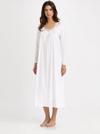 Ornate lace embroidery transforms this flowy, long-sleeve silhouette of pure cotton. ScoopneckEmbroidered lace at necklineFront shirringAbout 52 from shoulder to hemBody: mercerized cottonLace: polyesterMachine washImported Ornate lace embroidery transforms this flowy, long-sleeve silhouette of pure cotton. ScoopneckEmbroidered lace at necklineFront shirringAbout 52 from shoulder to hemBody: mercerized cottonLace: polyesterMachine washImported