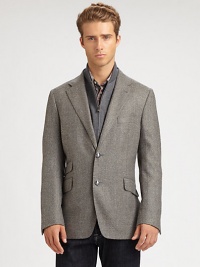 Expect the unexpected with this classically-inspired three-button blazer shaped in the supreme softness of a wool and cashmere blend, featuring a zip-out front vest panel and an additional front ticket pocket.Button-frontNotch lapelChest welt, waist flap pocketsSide vents86% wool/14% polyesterDry cleanMade in Italy