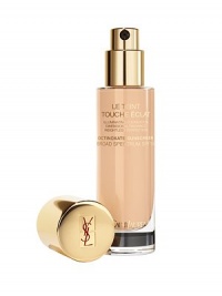 ILLUMINATING FOUNDATION- DIMENSIONAL RADIANCE- WEIGHTLESS PERFECTION. For the first time, the magic light of Touche Éclat is in a foundation. Infused in a weightless fluid, this formula targets shadowy areas and highlights the contours of the face. Free of opaque fillers, its perfecting texture evens the complexion and helps conceal imperfections, while enhancing your skin's natural beauty. Available in 16 shades. Made in France. 1 oz. ILLUMINATING FOUNDATION- DIMENSIONAL RADIANCE- WEIGHTLESS PERFECTION. For the first time, the magic light of Touche Éclat is in a foundation. Infused in a weightless fluid, this formula targets shadowy areas and highlights the contours of the face. Free of opaque fillers, its perfecting texture evens the complexion and helps conceal imperfections, while enhancing your skin's natural beauty. Available in 16 shades. Made in France. 1 oz.