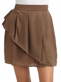 THE LOOKBanded waist with elastic backAsymmetrical ruffle detail THE FITAbout 20 longTHE MATERIALViscoseCARE & ORIGINDry cleanMade in USAModel shown is 5'10 (177cm) wearing US size Small. THE LOOKBanded waist with elastic backAsymmetrical ruffle detail THE FITAbout 20 longTHE MATERIALViscoseCARE & ORIGINDry cleanMade in USAModel shown is 5'10 (177cm) wearing US size Small.