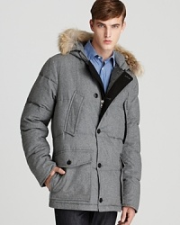 A distinctive, quilted, wool-blend shell is filled with down and feathers for incredible warmth, and the fur trim hood adds an element of luxury to this handsome cold-weather design. A distinctive, quilted, wool-blend shell is filled with down and feathers for incredible warmth, and the fur trim hood adds an element of luxury to this handsome cold-weather design.