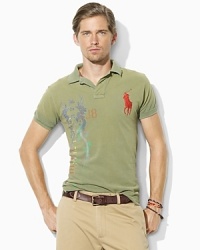Crafted in a trim, athletic fit from breathable cotton mesh, a short-sleeved polo shirt gets a bold update with an expedition-inspired graphic print. Crafted in a trim, athletic fit from breathable cotton mesh, a short-sleeved polo shirt gets a bold update with an expedition-inspired graphic print.