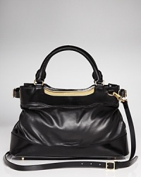True to form, this Burberry satchel works a classic vibe in rich leather with a versatile design that is perfect on the arm or across the body. True to form, this Burberry satchel works a classic vibe in rich leather with a versatile design that is perfect on the arm or across the body.
