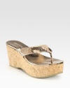 An exaggerated cork wedge lifts this seasonal essential, pairing metallic trim with snake-print leather for textured appeal. Cork wedge, 3 (75mm)Cork platform, 1½ (40mm)Compares to a 1½ heel (40mm)Snake-print leather and metallic leather upperMetallic leather liningRubber solePadded insoleMade in Italy