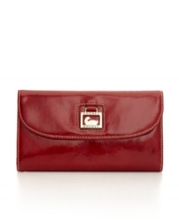 Patent leather adds glossy shine to Dooney & Bourke's sophisticated continental wallet. Patent leather adds glossy shine to Dooney & Bourke's sophisticated continental wallet.