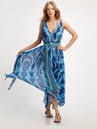 This flowy, semi-sheer style features plunge v-neck front and back with a handkerchief hem. Plus, it was designed to be worn in many ways including: belted, one-shoulder and crisscross.V-neck front and backSleevelessTie beltHandkerchief hemAbout 56 from shoulder to hemPolyesterHand washMade in USA of imported fabrics This flowy, semi-sheer style features plunge v-neck front and back with a handkerchief hem. Plus, it was designed to be worn in many ways including: belted, one-shoulder and crisscross.V-neck front and backSleevelessTie beltHandkerchief hemAbout 56 from shoulder to hemPolyesterHand washMade in USA of imported fabrics