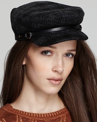 Brimming with Burberry, this wool cap is printed in a subtle black-and-gray check with a leather strap detail. Brimming with Burberry, this wool cap is printed in a subtle black-and-gray check with a leather strap detail.