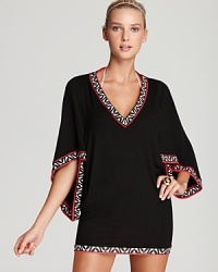 Elevate your poolside style in a Trina Turk coverup that boasts bold trim and elegant kimono sleeves. Elevate your poolside style in a Trina Turk coverup that boasts bold trim and elegant kimono sleeves.