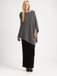 A hint of sparkle and asymmetrical hem add a modern touch to the classic poncho.BoatneckAsymmetrical hemPull-on styleAbout 24 from shoulder to hemMohair/nylon/wool/polyester/acrylic/alpacaDry cleanImported of Italian fabric A hint of sparkle and asymmetrical hem add a modern touch to the classic poncho.BoatneckAsymmetrical hemPull-on styleAbout 24 from shoulder to hemMohair/nylon/wool/polyester/acrylic/alpacaDry cleanImported of Italian fabric
