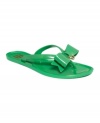 Put a bow on it. A structured plastic bow on Tommy Hilfiger's Beverly jelly flat thong sandals provides the perfect finishing touch to your easy, casual summer look.