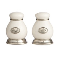 Fine vivid white ceramic is accented by hand with delicate pewter accents to create this graceful salt-and-pepper set from Arte Italica. Fine vivid white ceramic is accented by hand with delicate pewter accents to create this graceful salt-and-pepper set from Arte Italica.
