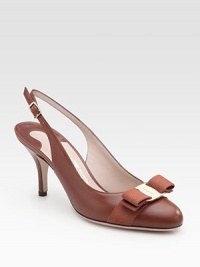 Lustrous leather pump with an elegant faille bow and adjustable slingback. Self-covered heel, 3 (75mm) Leather lining and sole Padded insole Made in Italy Lustrous leather pump with an elegant faille bow and adjustable slingback. Self-covered heel, 3 (75mm) Leather lining and sole Padded insole Made in Italy