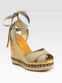 Secured by a grosgrain ribbon tie, this woven straw wedge has a canvas upper, hemp platform and studded leather trim. Straw wedge, 5 (125mm)Studded leather and hemp platform, 1½ (40mm)Compares to a 3½ heel (90mm)Canvas upperLeather lining and soleMade in SpainOUR FIT MODEL RECOMMENDS ordering true whole size; ½ sizes should order the next whole size up. Secured by a grosgrain ribbon tie, this woven straw wedge has a canvas upper, hemp platform and studded leather trim. Straw wedge, 5 (125mm)Studded leather and hemp platform, 1½ (40mm)Compares to a 3½ heel (90mm)Canvas upperLeather lining and soleMade in SpainOUR FIT MODEL RECOMMENDS ordering true whole size; ½ sizes should order the next whole size up.