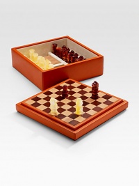 Become the king or queen of any party with a chess set handsomely crafted in leather-upholstered wood with an interlaced leather board. Set includes plastic chessmen and two blocknotes. From the Bugrane Collection 11¼W X 4½H X 11¼D Made in Italy Become the king or queen of any party with a chess set handsomely crafted in leather-upholstered wood with an interlaced leather board. Set includes plastic chessmen and two blocknotes. From the Bugrane Collection 11¼W X 4½H X 11¼D Made in Italy