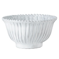 Handmade and inspired by the maestro artisan's family heirloom dinnerware, this ceramic serving bowl makes a rustically sophisticated dining statement. Handmade and inspired by the maestro artisan's family heirloom dinnerware, this ceramic serving bowl makes a rustically sophisticated dining statement.
