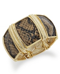 Fierce design for the bold fashionista. Alfani's brown python cuff bracelet slips over the wrist and adds bite to your wardrobe. Crafted in gold tone mixed metal. Approximate length: 7-1/4 inches. Fierce design for the bold fashionista. Alfani's brown python cuff bracelet slips over the wrist and adds bite to your wardrobe. Crafted in gold tone mixed metal. Approximate length: 7-1/4 inches.