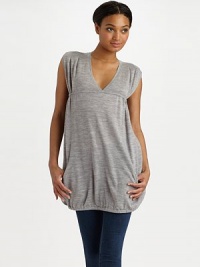THE LOOKRibbed V-neck Pullover style Sleeveless with over-sized ribbed arm holes Drawstring back empire waist Front zip slash pockets Elastic hemTHE FITAbout 31 ½ from shoulder to hemTHE MATERIALMerino woolCARE & ORIGINDry clean Imported THE LOOKRibbed V-neck Pullover style Sleeveless with over-sized ribbed arm holes Drawstring back empire waist Front zip slash pockets Elastic hemTHE FITAbout 31 ½ from shoulder to hemTHE MATERIALMerino woolCARE & ORIGINDry clean Imported