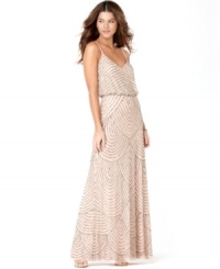 Look radiant in Adrianna Papell's breathtaking new evening gown. A blouson-style bodice highlights the sheer overlay that features brilliant rows of beaded detail. Look radiant in Adrianna Papell's breathtaking new evening gown. A blouson-style bodice highlights the sheer overlay that features brilliant rows of beaded detail.