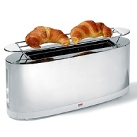 Toaster by Alessi with bun warmer in white. Alessi makes an ordinary product chic and special with its stylish design. Toaster by Alessi with bun warmer in white. Alessi makes an ordinary product chic and special with its stylish design.