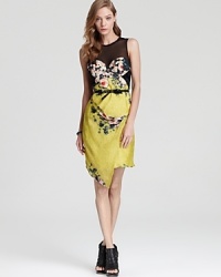 ABS by Allen Schwartz does garden-party chic with this bustier-style dress. With a sheer mesh yoke, a romantic print and a bow-detailed belt, this floral frock is impossible to pass up. ABS by Allen Schwartz does garden-party chic with this bustier-style dress. With a sheer mesh yoke, a romantic print and a bow-detailed belt, this floral frock is impossible to pass up.