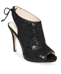 With all-over sequins and sexy lace-up detail on the back, the Dulce platform booties by Caparros are the perfect choice for your big night out. With all-over sequins and sexy lace-up detail on the back, the Dulce platform booties by Caparros are the perfect choice for your big night out.