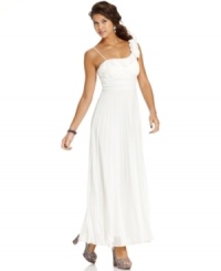 Glam gown alert! Step out in this elegant empire dress from Speechless featuring lovely long pleats, a one-shoulder design and cute rosettes. Glam gown alert! Step out in this elegant empire dress from Speechless featuring lovely long pleats, a one-shoulder design and cute rosettes.