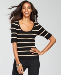 A scoopneck sweater from INC gets the glam treatment with metallic stripes and rhinestone buttons at the sleeves! A scoopneck sweater from INC gets the glam treatment with metallic stripes and rhinestone buttons at the sleeves!