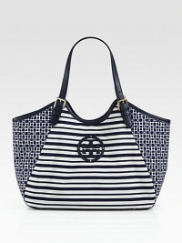 A fun mixed-print style in lightweight nylon with luxurious leather trim.Double adjustable leather top handles, 7-9 dropMagnetic snap closureOne inside zip pocketTwo inside open pocketsCotton lining13W X 12H X 5DImported A fun mixed-print style in lightweight nylon with luxurious leather trim.Double adjustable leather top handles, 7-9 dropMagnetic snap closureOne inside zip pocketTwo inside open pocketsCotton lining13W X 12H X 5DImported