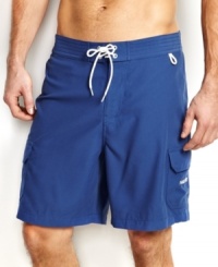 You'll be beach-ready with solid surf style with these swim shorts from Nautica. You'll be beach-ready with solid surf style with these swim shorts from Nautica.