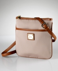 A versatile crossbody bag in a preppy striped pattern is imbued with casual sophistication for a modern look with a hint of romance. A versatile crossbody bag in a preppy striped pattern is imbued with casual sophistication for a modern look with a hint of romance.