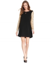 DKNYC's sweet shift silhouette is made party-perfect with sparkling sequined sleeves. DKNYC's sweet shift silhouette is made party-perfect with sparkling sequined sleeves.