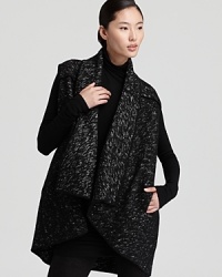 This Donna Karan New York tweed vest is the finishing touch to your fall capsule collection. A draped collar and piped seams are the perfect accents to the chic style, effortless over everything from a turtleneck sweater to a little black dress. This Donna Karan New York tweed vest is the finishing touch to your fall capsule collection. A draped collar and piped seams are the perfect accents to the chic style, effortless over everything from a turtleneck sweater to a little black dress.