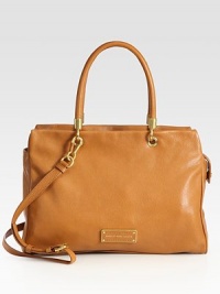 A clean, refined and polished shape of soft pebble-grain leather. Double top handles, 7¼ dropAdjustable detachable shoulder strap, 19-23 dropTop zip closureProtective metal feetOne inside zip pocketTwo inside open pocketsLogo-printed lining15W X 11H X 5½DImported A clean, refined and polished shape of soft pebble-grain leather. Double top handles, 7¼ dropAdjustable detachable shoulder strap, 19-23 dropTop zip closureProtective metal feetOne inside zip pocketTwo inside open pocketsLogo-printed lining15W X 11H X 5½DImported