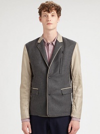 Varsity-inspired design updates a traditional two-button blazer silhouette with contrasting trim and sleeves for a modern look that references collegiate-cool.Button-frontNotch lapelChest welt, waist flap pocketsBody: 70% wool/27% polyester/3% other fabricsSleeves: 95% cotton/5% polyurethaneDry cleanMade in USA Varsity-inspired design updates a traditional two-button blazer silhouette with contrasting trim and sleeves for a modern look that references collegiate-cool.Button-frontNotch lapelChest welt, waist flap pocketsBody: 70% wool/27% polyester/3% other fabricsSleeves: 95% cotton/5% polyurethaneDry cleanMade in USA