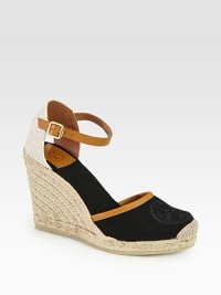 Rich canvas with smooth leather trim forms this classic silhouette, resting on a textured espadrille wedge. Covered wedge, 4 (100mm)Covered platform, ½ (15mm)Compares to a 3½ heel (90mm)Canvas upper with leather trimAdjustable ankle strapCanvas liningRubber solePadded insoleImported Rich canvas with smooth leather trim forms this classic silhouette, resting on a textured espadrille wedge. Covered wedge, 4 (100mm)Covered platform, ½ (15mm)Compares to a 3½ heel (90mm)Canvas upper with leather trimAdjustable ankle strapCanvas liningRubber solePadded insoleImported