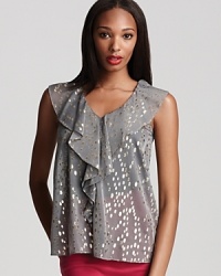 Be the picture of whimsy in BCBGeneration's ruffled top adorned with shimmering metallic polka dots for endless dazzling nights. At back, a v-shaped keyhole with a pretty button closure to complete this fabulous style for a season of glamour. Be the picture of whimsy in BCBGeneration's ruffled top adorned with shimmering metallic polka dots for endless dazzling nights. At back, a v-shaped keyhole with a pretty button closure to complete this fabulous style for a season of glamour.