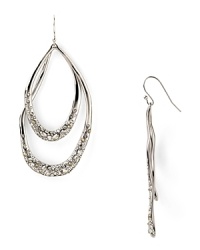 Give into galactic glamour with this pair of orbiting hoop earrings from Alexis Bittar. Dusted with Swarovski crystals, this shapely pair begs to be shown off. Give into galactic glamour with this pair of orbiting hoop earrings from Alexis Bittar. Dusted with Swarovski crystals, this shapely pair begs to be shown off.