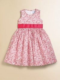 A beautiful Liberty floral from England looks lovely in a full frock with wide grosgrain ties.Round necklineSleevelessEmpire waist with grosgrain ribbon back tiesBack button closeFull skirtCotton liningCottonMachine washImported Please note: Number of buttons may vary depending on size ordered. A beautiful Liberty floral from England looks lovely in a full frock with wide grosgrain ties.Round necklineSleevelessEmpire waist with grosgrain ribbon back tiesBack button closeFull skirtCotton liningCottonMachine washImported Please note: Number of buttons may vary depending on size ordered.