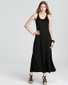 An elegant back knot lends a graceful air to this DKNY maxi dress. Pair with gold accents for sleek city style.