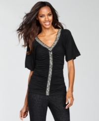 Beading and ruching together create a soft, feminine look for INC's fitted top. Beading and ruching together create a soft, feminine look for INC's fitted top.