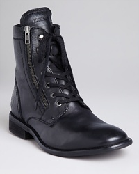 Diesel's Miliboots show off a side zip detail for an edgy finish. A laceup vamp completes the look. Diesel's Miliboots show off a side zip detail for an edgy finish. A laceup vamp completes the look.