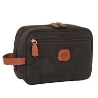This spacious travel kit is an elegant companion for any traveler. Pockets on the sides of the internal compartment offer space to organize small items or bottles. This spacious travel kit is an elegant companion for any traveler. Pockets on the sides of the internal compartment offer space to organize small items or bottles.