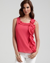 Cascading pleats lend feminine flair to DKNYC's summer-perfect top. Layer with a blazer at the office or team with denim on the weekend. Cascading pleats lend feminine flair to DKNYC's summer-perfect top. Layer with a blazer at the office or team with denim on the weekend.