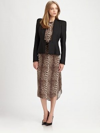 Ultra-structured blazer of lightweight wool has a unique button-front, split cuffs and an unanticipated back peplum detail. CollarlessLong sleeves with split cuffsButton-frontFully linedAbout 21 from shoulder to hemWoolDry cleanImportedModel shown is 5'10 (177cm) wearing US size 0. Ultra-structured blazer of lightweight wool has a unique button-front, split cuffs and an unanticipated back peplum detail. CollarlessLong sleeves with split cuffsButton-frontFully linedAbout 21 from shoulder to hemWoolDry cleanImportedModel shown is 5'10 (177cm) wearing US size 0.