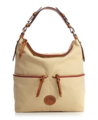 Offered in a variety of fun colors and prints, this Macy's exclusive Dooney & Bourke design will keep your look classic and chic. Convenient pockets and sleek contrast trim decorate this satchel shape for day to night style. Offered in a variety of fun colors and prints, this Macy's exclusive Dooney & Bourke design will keep your look classic and chic. Convenient pockets and sleek contrast trim decorate this satchel shape for day to night style.