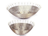 Bold, eye-catching lines capture all the grace and energy of a big splash. Designer Michael Aram uses stainless steel wire and brass welds to create his signature blend of modern material and organic form. From top: 13 Basket, 9 Basket. Bold, eye-catching lines capture all the grace and energy of a big splash. Designer Michael Aram uses stainless steel wire and brass welds to create his signature blend of modern material and organic form. From top: 13 Basket, 9 Basket.