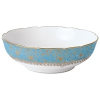 Inspired by the flamboyant designs of the 19th century, Eden Turquoise is both refined and sophisticated. This Limoges porcelain dinnerware service is a remarkable reproduction that captures the beauty of engraved gold work. Made in Limoges, France.
