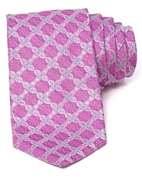An optic floral print conforms into a grid-like pattern on a silk tie from Ike Behar. An optic floral print conforms into a grid-like pattern on a silk tie from Ike Behar.