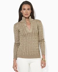 An essential sweater, crafted from soft cable-knit cotton and interwoven Lurex®, features a split mockneck collar for a flattering finish. An essential sweater, crafted from soft cable-knit cotton and interwoven Lurex®, features a split mockneck collar for a flattering finish.